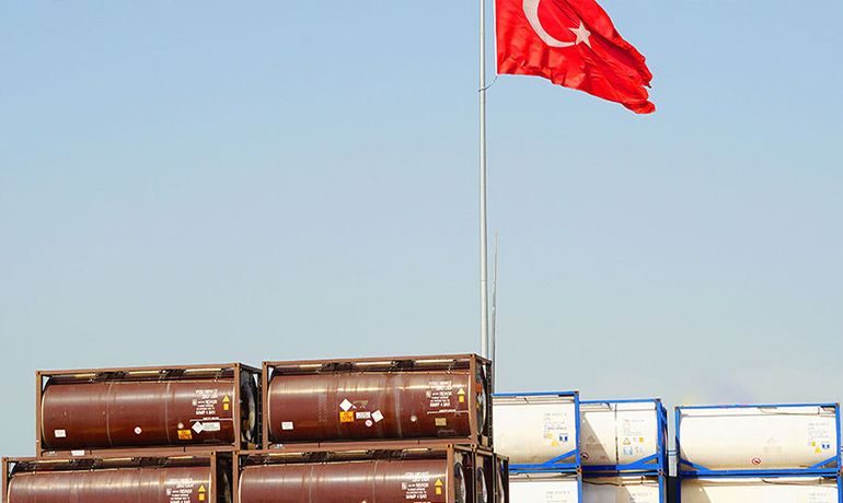 Loaded and empty tank containers in storage
